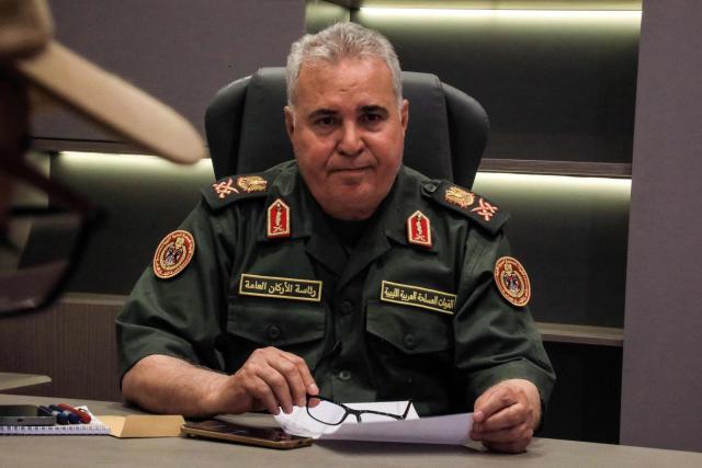 Head of the Operations Room of the Libyan Army Major General Abdullah Nour al-Din, speaks during the "Dara’ al-Karama 2" military exercises, in the Ras al-Alba region in southeastern Libya on May 16, 2026. The military exercises involve extensive participation from various ground, air, and naval units, making them one of the largest exercises the Libyan Army has conducted in recent years, with more than 25,000 military personnel taking part. (Photo by Abdullah DOMA / AFP)