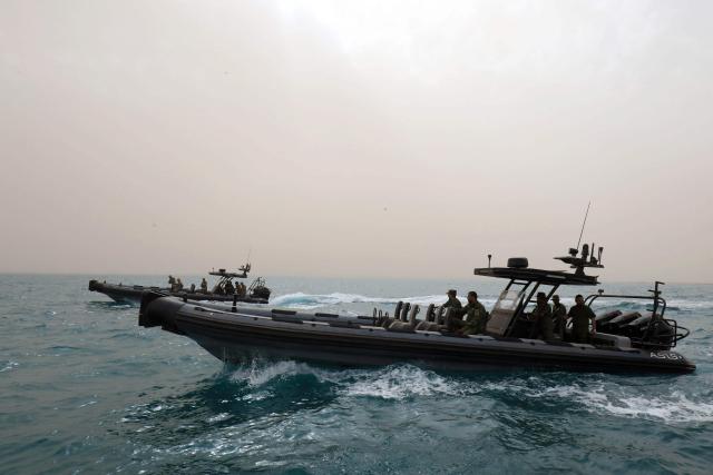 Members of the Libyan navy take part in the "Dara’ al-Karama 2" military exercises, in the Ras al-Alba region in southeastern Libya on May 16, 2026. The military exercises involve extensive participation from various ground, air, and naval units, making them one of the largest exercises the Libyan Army has conducted in recent years, with more than 25,000 military personnel taking part. (Photo by Abdullah DOMA / AFP)