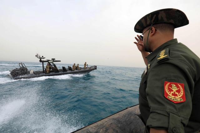 Members of the Libyan navy take part in the "Dara’ al-Karama 2" military exercises, in the Ras al-Alba region in southeastern Libya on May 16, 2026. The military exercises involve extensive participation from various ground, air, and naval units, making them one of the largest exercises the Libyan Army has conducted in recent years, with more than 25,000 military personnel taking part. (Photo by Abdullah DOMA / AFP)