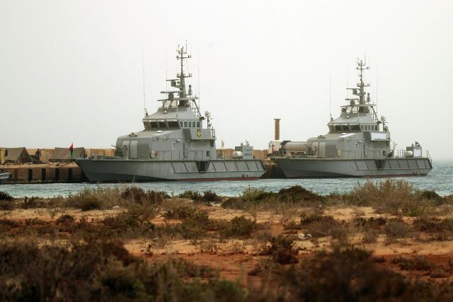Vessels of the Libyan navy take part in the "Dara’ al-Karama 2" military exercises, in the Ras al-Alba region in southeastern Libya on May 16, 2026. The military exercises involve extensive participation from various ground, air, and naval units, making them one of the largest exercises the Libyan Army has conducted in recent years, with more than 25,000 military personnel taking part. (Photo by Abdullah DOMA / AFP)