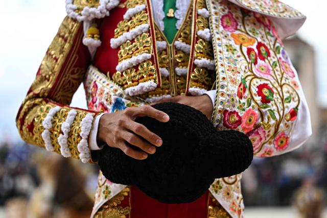 French matador Carlos Olsina holds his montera (hat) during the paseo (parade) ahead of his bullfight in Ales, Southern France, on May 16, 2026. (Photo by Gabriel BOUYS / AFP)