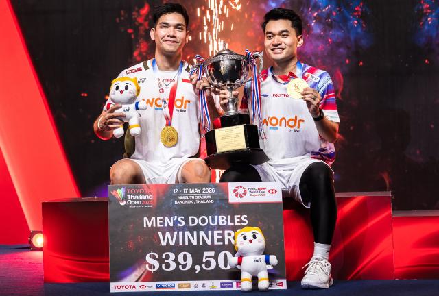Indonesia's Leo Rolly Carnando and Indonesia's Daniel Marthin pose with the trophy after winning against India's Chirag Shetty and India's Satwiksairaj Rankireddy during their men's doubles final match at the Thailand Open badminton tournament in Bangkok on May 17, 2026 (Photo by Chanakarn LAOSARAKHAM / AFP)