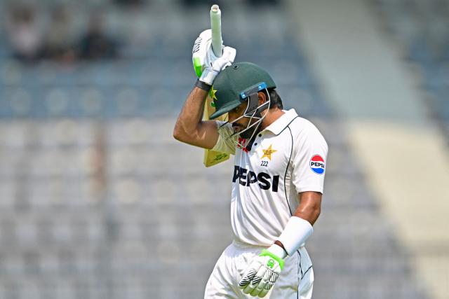 Pakistan’s Babar Azam walks back to the pavilion after his dismissal by Bangladesh’s Nahid Rana during the second day of the second Test cricket match between Bangladesh and Pakistan at the Sylhet International Cricket Stadium in Sylhet on May 17, 2026. (Photo by Munir UZ ZAMAN / AFP)