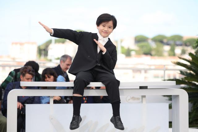 Japanese actor Rimu Kuwaki poses during a photocall of the film "Sheep in The Box" at the 79th edition of the Cannes Film Festival in Cannes, southern France on May 17, 2026. (Photo by Valery HACHE / AFP)