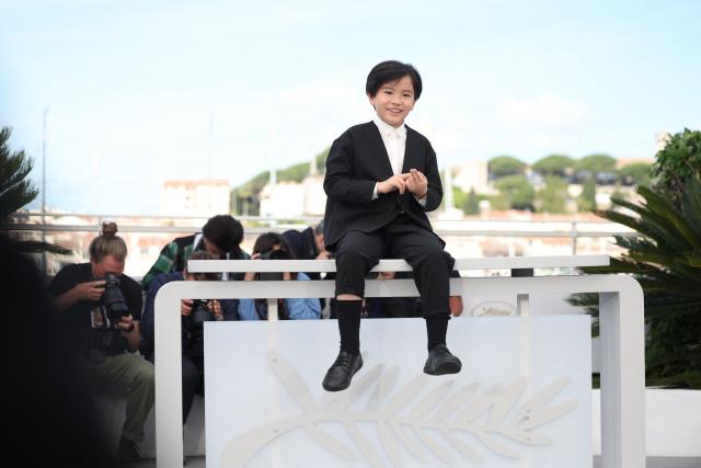 Japanese actor Rimu Kuwaki poses during a photocall of the film "Sheep in The Box" at the 79th edition of the Cannes Film Festival in Cannes, southern France on May 17, 2026. (Photo by Valery HACHE / AFP)
