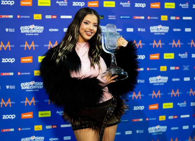Winner Darina Nikolaeva Yotova, aka Dara and representing Bulgaria with the song 'Bangaranga' poses with the trophy prior to a press conference after she won the final of the Eurovision Song Contest 2026 (ESC) at Wiener Stadthalle in Vienna, Austria on May 16, 2026. (Photo by GEORG HOCHMUTH / APA / AFP) / Austria OUT
