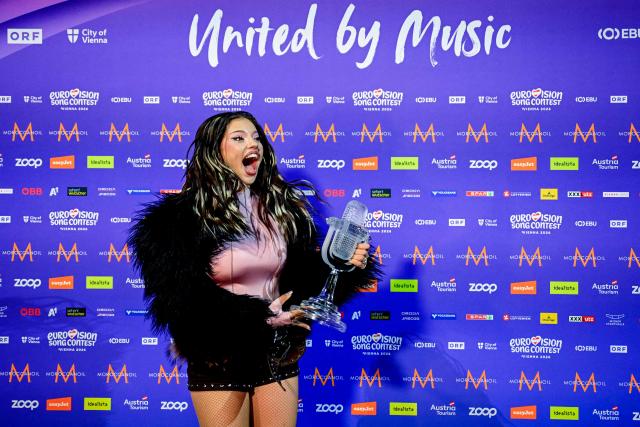 Winner Darina Nikolaeva Yotova, aka Dara and representing Bulgaria with the song 'Bangaranga' poses with the trophy during a photocall after she won the final of the Eurovision Song Contest 2026 (ESC) at Wiener Stadthalle in Vienna, Austria on May 16, 2026. (Photo by Tobias SCHWARZ / AFP)