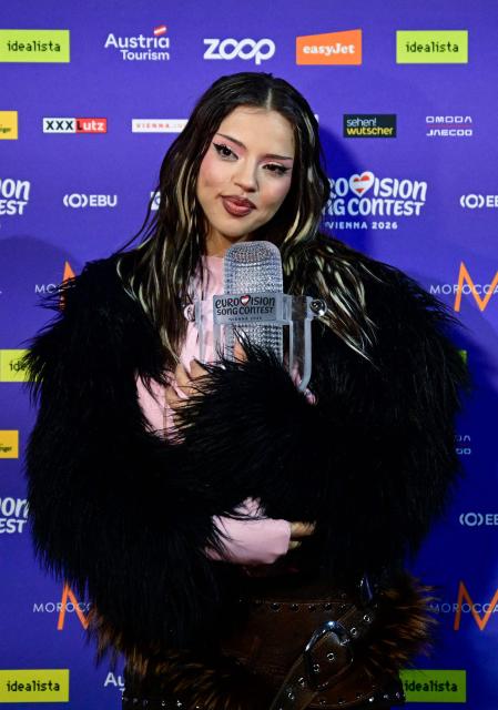 Winner Darina Nikolaeva Yotova, aka Dara and representing Bulgaria with the song 'Bangaranga' poses with the trophy during a photocall after she won the final of the Eurovision Song Contest 2026 (ESC) at Wiener Stadthalle in Vienna, Austria on May 16, 2026. (Photo by Tobias SCHWARZ / AFP)