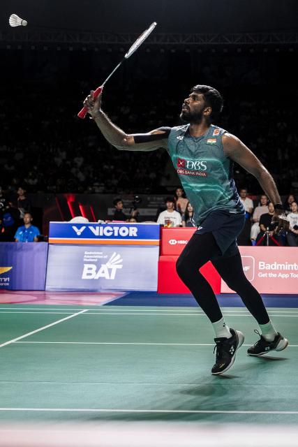 India's Chirag Shetty and Satwiksairaj Rankireddy (not pictured) play a point against Indonesia’s Leo Rolly Carnando and Daniel Marthin during their men's doubles final match at the Thailand Open badminton tournament in Bangkok on May 17, 2026. (Photo by chanakarn LAOSARAKHAM / AFP)