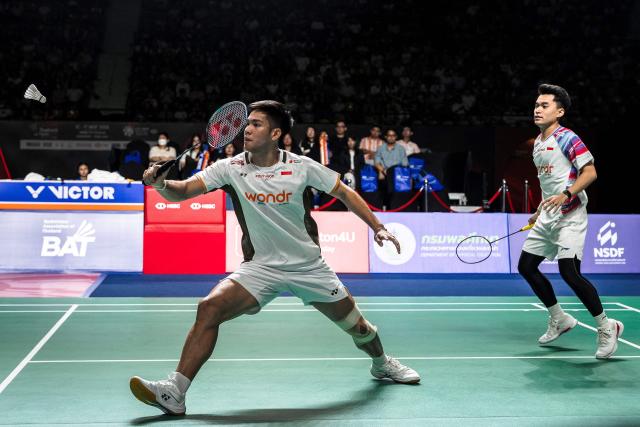 Indonesia’s Leo Rolly Carnando and Daniel Marthin play a point against India's Chirag Shetty and Satwiksairaj Rankireddy during their men's doubles final match at the Thailand Open badminton tournament in Bangkok on May 17, 2026. (Photo by chanakarn LAOSARAKHAM / AFP)