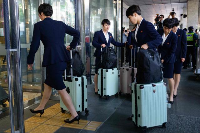 North Korea's Naegohyang Women's FC players arrive at a hotel in Suwon on May 17, 2026, ahead of the Women's Asian Champions League semi-final football match against South Korea's Suwon FC Women. A North Korean women's football team landed in South Korea on May 17, marking the first visit by a sports team from the isolated country to its southern neighbour in eight years, to play in the Asian Champions League semi-finals. (Photo by Shin Yong-ju / AFP)
