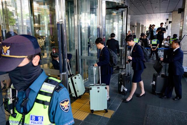 North Korea's Naegohyang Women's FC players arrive at a hotel in Suwon on May 17, 2026, ahead of the Women's Asian Champions League semi-final football match against South Korea's Suwon FC Women. A North Korean women's football team landed in South Korea on May 17, marking the first visit by a sports team from the isolated country to its southern neighbour in eight years, to play in the Asian Champions League semi-finals. (Photo by Shin Yong-ju / AFP)