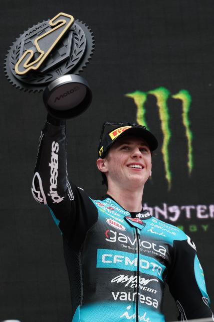 Team CF Moto Aspar Racing Team's Maximo Quiles holds up the trophy on the podium after winning the Moto3 race of the 2026 Catalunya Moto Grand Prix at the Catalunya racetrack in Montmelo, near Barcelona, on May 17, 2026. (Photo by Lluis GENE / AFP)