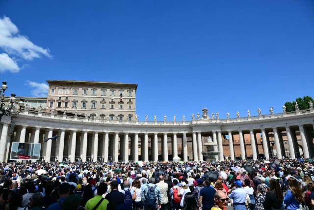 Pope Leo XIV addresses the crowd from the window of the apostolic palace overlooking St. Peter's square during the Regina Caeli prayer in The Vatican on May 17, 2026. (Photo by Stefano RELLANDINI / AFP)