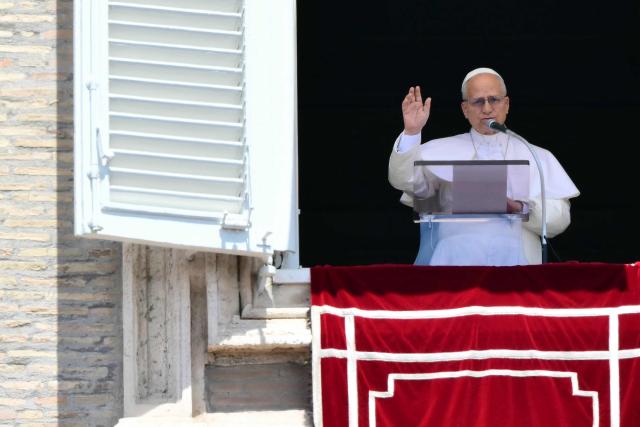 Pope Leo XIV addresses the crowd from the window of the apostolic palace overlooking St. Peter's square during the Regina Caeli prayer in The Vatican on May 17, 2026. (Photo by Stefano RELLANDINI / AFP)