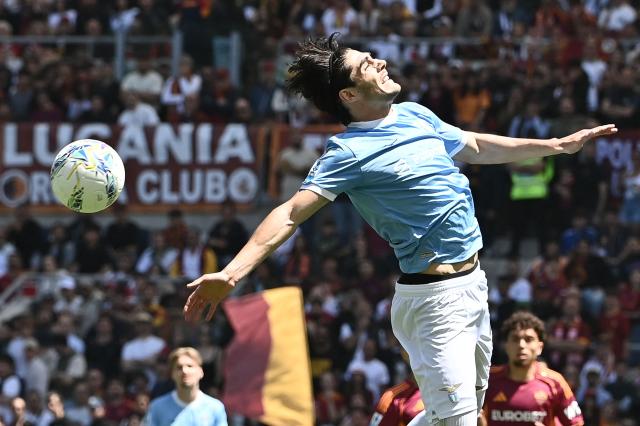 Lazio's Italian forward #22 Matteo Cancellieri heads the ball during the Italian Serie A football match between Roma and Lazio at Olympic stadium in Rome on May 17, 2026. (Photo by Isabella BONOTTO / AFP)