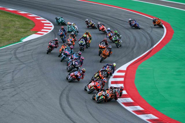 Team Speed Up Racing's Celestino Vietti (bottom) leads during the start of the Moto2 race of the 2026 Catalunya Moto Grand Prix at the Catalunya racetrack in Montmelo, near Barcelona, on May 17, 2026. (Photo by JOSE JORDAN / AFP)