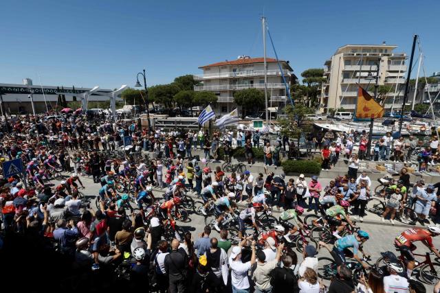 Riders arrive to take the start of the 9th stage of the Giro d'Italia 2026 - Tour of Italy cycling race between Cervia and Corno alle Scale, central Italy on May 17, 2026. (Photo by Luca Bettini / AFP)