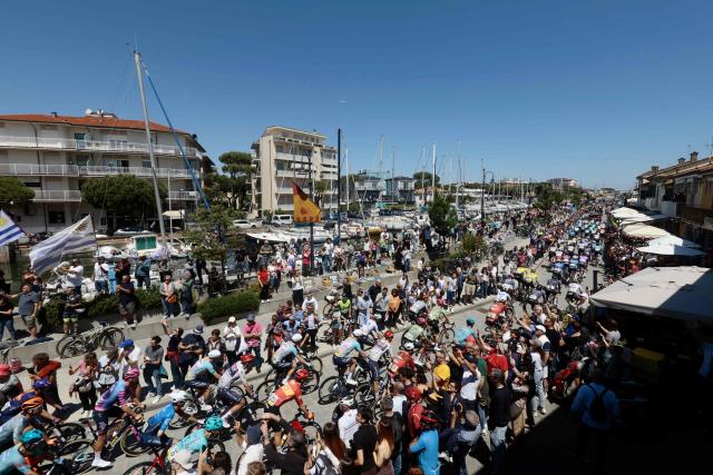 Riders arrive to take the start of the 9th stage of the Giro d'Italia 2026 - Tour of Italy cycling race between Cervia and Corno alle Scale, central Italy on May 17, 2026. (Photo by Luca Bettini / AFP)