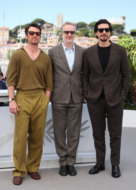 (From L) US actor Miles Teller, US director and screenwriter James Gray and US actor Adam Driver pose during a photocall of the film "Paper Tiger" at the 79th edition of the Cannes Film Festival in Cannes, southern France on May 17, 2026. (Photo by Valery HACHE / AFP)
