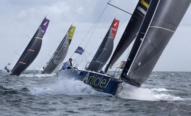 French skipper Arnaud Biston on his boat "Article.1" takes the start of the Solitaire du Figaro, a single-handed multi-stage sailing race created in 1970 by Jean-Louis Guillemard and Jean-Michel Barrault, in Perros-Guirrec, western France,  May 17, 2026. (Photo by Fred TANNEAU / AFP)
