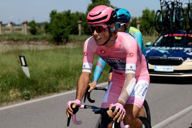 Bahrain - Victorious Portuguese rider Afonso Eulalio, wearing the overall leader's pink jersey (Maglia Rosa), rides at the start of the 9th stage of the Giro d'Italia 2026 - Tour of Italy cycling race between Cervia and Corno alle Scale, central Italy on May 17, 2026. (Photo by Luca Bettini / AFP)