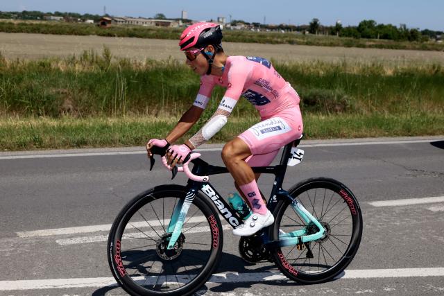 Bahrain - Victorious Portuguese rider Afonso Eulalio, wearing the overall leader's pink jersey (Maglia Rosa), rides at the start of the 9th stage of the Giro d'Italia 2026 - Tour of Italy cycling race between Cervia and Corno alle Scale, central Italy on May 17, 2026. (Photo by Luca Bettini / AFP)