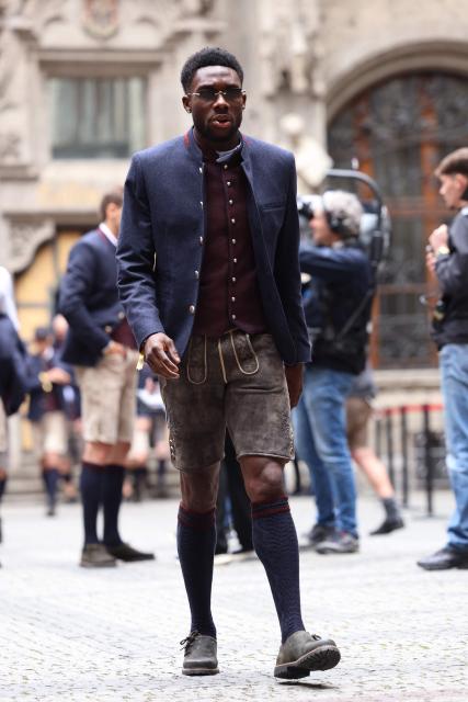 Bayern Munich's Canadian defender #19 Alphonso Davies arrives to celebrate with Bayern Munich's players their 35th Bundesliga title at the City Hall at Marienplatz in Munich, southern Germany, on May 17, 2026. (Photo by Alexandra BEIER / AFP)