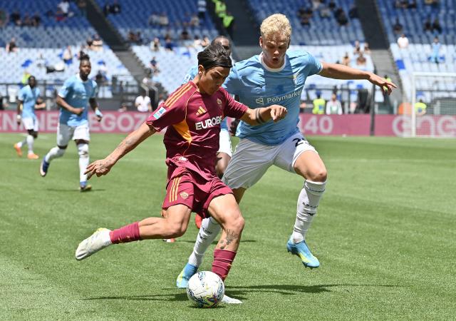 Roma's Argentine forward #21 Paulo Dybala fights for the ball with Lazio's Danish defender #25 Oliver Provstgaard (R) during the Italian Serie A football match between Roma and Lazio at Olympic stadium in Rome on May 17, 2026. (Photo by Isabella BONOTTO / AFP)