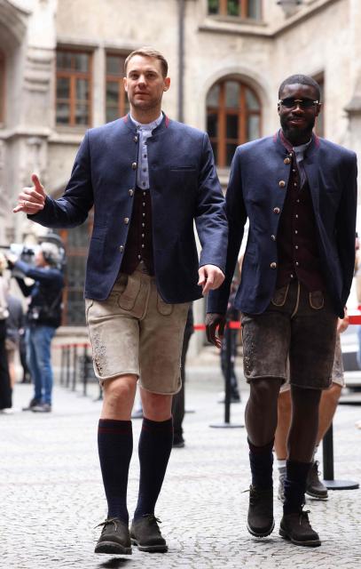 Bayern Munich's German goalkeeper #01 Manuel Neuer and Bayern Munich's French defender #02 Dayot Upamecano arrive to celebrate with Bayern Munich's players their 35th Bundesliga title at the City Hall at Marienplatz in Munich, southern Germany, on May 17, 2026. (Photo by Alexandra BEIER / AFP)