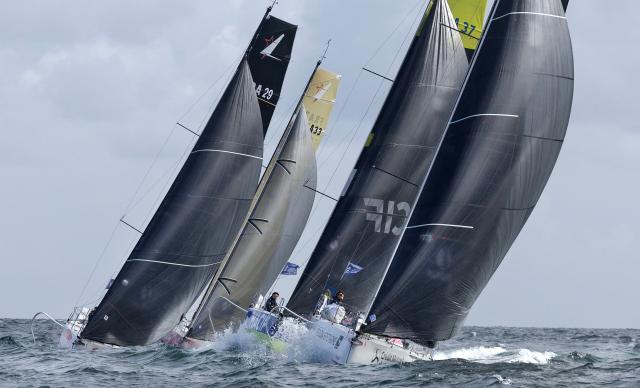 Boats take the start of the Solitaire du Figaro, a single-handed multi-stage sailing race created in 1970 by Jean-Louis Guillemard and Jean-Michel Barrault, in Perros-Guirrec, western France, May 17, 2026. (Photo by Fred TANNEAU / AFP)