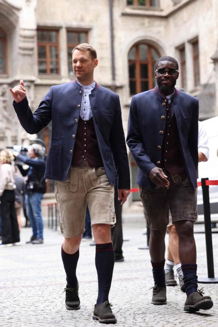Bayern Munich's German goalkeeper #01 Manuel Neuer and Bayern Munich's French defender #02 Dayot Upamecano arrive to celebrate with Bayern Munich's players their 35th Bundesliga title at the City Hall at Marienplatz in Munich, southern Germany, on May 17, 2026. (Photo by Alexandra BEIER / AFP)