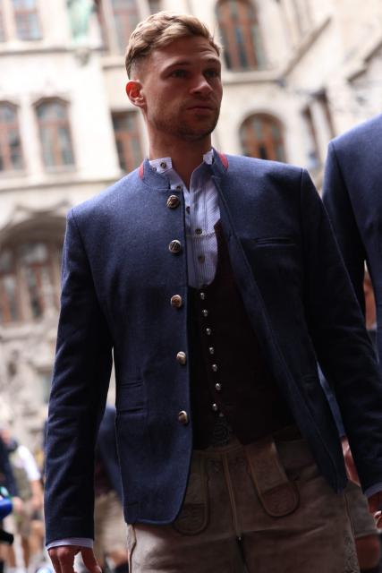 Bayern Munich's German midfielder #06 Joshua Kimmich arrives to celebrate with Bayern Munich's players their 35th Bundesliga title at the City Hall at Marienplatz in Munich, southern Germany, on May 17, 2026. (Photo by Alexandra BEIER / AFP)