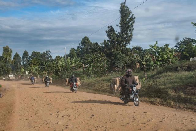 CORRECTION / Boda Boda (motocycle) riders move in groups from Congo into Uganda in Padea on May 17, 2026. Ugandan officials confirmed that a 59-year-old man from DR Congo had died in Kampala after being admitted earlier in the week. His body was repatriated the same day. 
Tests showed the victim in Uganda was infected with the Bundibugyo strain of Ebola, first identified in 2007.. The World Health Organization declared an international health emergency on Sunday over an outbreak of an Ebola strain in the Democratic Republic of Congo that has killed more than 80 and for which there is no vaccine.
Fears of further spread grew when a laboratory on Sunday confirmed a case in the major eastern DRC city of Goma, which is controlled by the Rwanda-backed M23 militia.
A total of 88 deaths and 336 suspected cases of the highly contagious haemorrhagic fever have so far been reported, the Africa Centres for Disease Control and Prevention (CDC Africa) said in an update on Saturday. (Photo by Badru KATUMBA / AFP) / The erroneous mention[s] appearing in the metadata of this photo by Badru KATUMBA has been modified in AFP systems in the following manner: [Padea] instead of [Pader]. Please immediately remove the erroneous mention[s] from all your online services and delete it (them) from your servers. If you have been authorized by AFP to distribute it (them) to third parties, please ensure that the same actions are carried out by them. Failure to promptly comply with these instructions will entail liability on your part for any continued or post notification usage. Therefore we thank you very much for all your attention and prompt action. We are sorry for the inconvenience this notification may cause and remain at your disposal for any further information you may require.