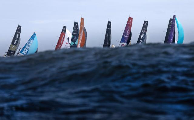 Boats take the start of the Solitaire du Figaro, a single-handed multi-stage sailing race created in 1970 by Jean-Louis Guillemard and Jean-Michel Barrault, in Perros-Guirrec, western France, May 17, 2026. (Photo by Fred TANNEAU / AFP)