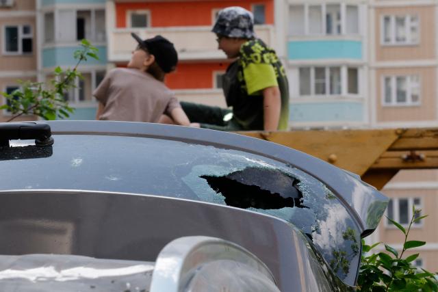 This photograph shows a damaged car in the courtyard of a residential building following an air attack in Krasnogorsk, Moscow region on May 17, 2026, amid the ongoing Russian-Ukrainian conflict. A wave of almost 600 Ukrainian drones attacked Russia overnight killing four people, authorities said on May 17, 2026, as Ukraine's President Volodymyr Zelensky called the barrage an 'entirely justified' retribution for Moscow's own pummelling of Ukraine. (Photo by TATYANA MAKEYEVA / AFP)