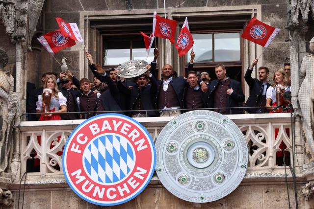 Bayern Munich's team celebrate their 35th Bundesliga championship title on the balcony at the City Hall at Marienplatz in Munich, southern Germany, on May 17, 2026. (Photo by Alexandra BEIER / AFP)