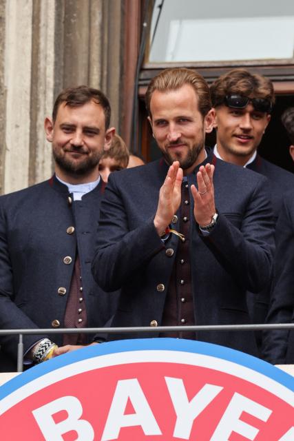 Bayern Munich's English forward #09 Harry Kane acknowledges the crowd as Bayern Munich's players celebrate their 35th Bundesliga championship title at the City Hall at Marienplatz in Munich, southern Germany, on May 17, 2026. (Photo by Alexandra BEIER / AFP)