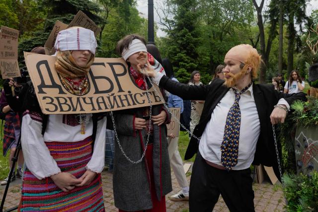 Protesters take part in a demonstration against the new Civil Code, warning it could restrict the rights of women, children, people with disabilities, and the LGBTQ community by regulating issues such as abortion, early marriage, and alimony in Kyiv on May 17, 2026, amid the Russian invasion of Ukraine. (Photo by Tetiana DZHAFAROVA / AFP)