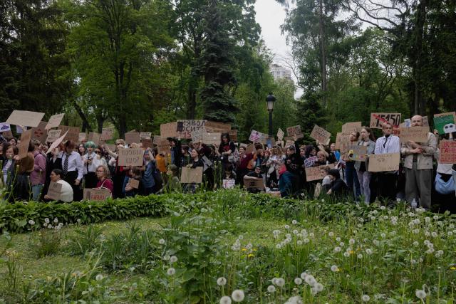 Protesters hold placards during a demonstration against the new Civil Code, warning it could restrict the rights of women, children, people with disabilities, and the LGBTQ community by regulating issues such as abortion, early marriage, and alimony in Kyiv on May 17, 2026, amid the Russian invasion of Ukraine. (Photo by Tetiana DZHAFAROVA / AFP)