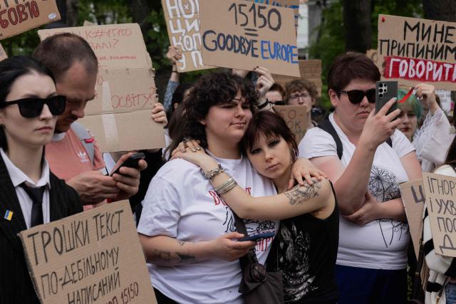 Protesters take part in a demonstration against the new Civil Code, warning it could restrict the rights of women, children, people with disabilities, and the LGBTQ community by regulating issues such as abortion, early marriage, and alimony in Kyiv on May 17, 2026, amid the Russian invasion of Ukraine. (Photo by Tetiana DZHAFAROVA / AFP)