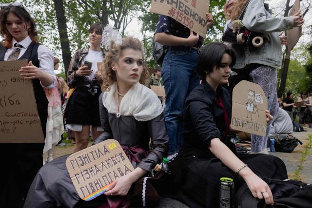 Protesters take part in a demonstration against the new Civil Code, warning it could restrict the rights of women, children, people with disabilities, and the LGBTQ community by regulating issues such as abortion, early marriage, and alimony in Kyiv on May 17, 2026, amid the Russian invasion of Ukraine. (Photo by Tetiana DZHAFAROVA / AFP)