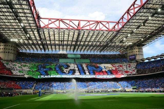 Supporters perform a pre-show choreography before the Italian Serie A football match between Inter Milan and Hellas Verona at San Siro stadium in Milan, on May 17, 2026. (Photo by Marco BERTORELLO / AFP)