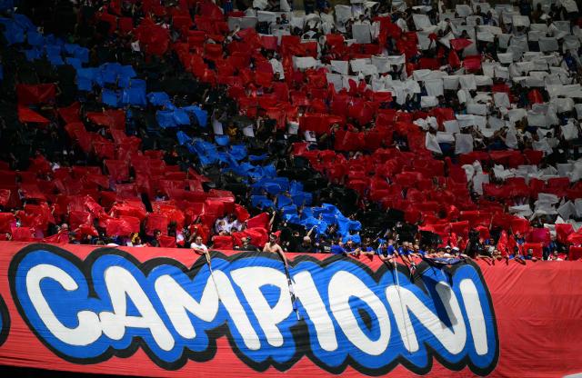 Supporters perform a pre-show choreography before the Italian Serie A football match between Inter Milan and Hellas Verona at San Siro stadium in Milan, on May 17, 2026. (Photo by Marco BERTORELLO / AFP)