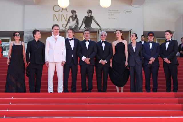 (From L) French composer Laetitia Pansanel-Garric, French actor Felix Lefebvre, German actor Lars Eidinger, Hungarian director Laszlo Nemes, French actor Gilles Lellouche, French producer Alain Goldman, French actress Louise Bourgoin, French screenwriter Olivier Demangel, French actress Hortense Quentin De Gromard arrive for the screening of the film "Moulin" at the 79th edition of the Cannes Film Festival in Cannes, southern France on May 17, 2026. (Photo by Thibaud MORITZ / AFP)