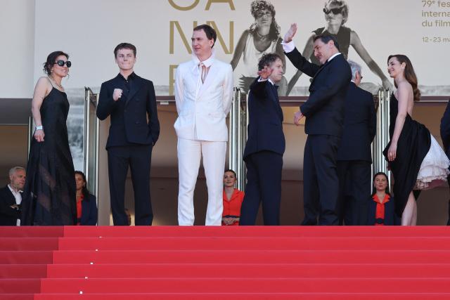 (From L) French composer Laetitia Pansanel-Garric, French actor Felix Lefebvre, German actor Lars Eidinger, Hungarian director Laszlo Nemes, French actor Gilles Lellouche and French actress Louise Bourgoin arrive for the screening of the film "Moulin" at the 79th edition of the Cannes Film Festival in Cannes, southern France on May 17, 2026. (Photo by Thibaud MORITZ / AFP)