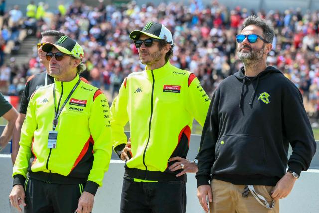 Former MotoGP World Champion Valentino Rossi (C) looks on after Team Pertamina Enduro VR46 Racing Team's Fabio Di Giannantonio won the 2026 Catalunya Moto GP Grand Prix at the Catalunya racetrack in Montmelo, near Barcelona, on May 17, 2026. (Photo by JOSE JORDAN / AFP)