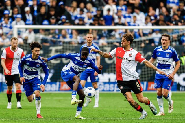 PEC Zwolle's Dutch midfielder Jamiro Monteiro (L) and Feyenoord's Dutch midfielder Luciano Valente fight for the ball during the Dutch Eredivisie football match between PEC Zwolle and Feyenoord at the MAC3Park stadium in Zwolle on May 17, 2026. (Photo by Vincent Jannink / ANP / AFP) / Netherlands OUT