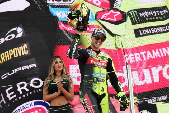 Team Pertamina Enduro VR46 Racing Team's Fabio Di Giannantonio celebrates on the podium after winning the 2026 Catalunya Moto GP Grand Prix at the Catalunya racetrack in Montmelo, near Barcelona, on May 17, 2026. (Photo by Lluis GENE / AFP)