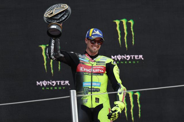 Team Pertamina Enduro VR46 Racing Team's Fabio Di Giannantonio celebrates on the podium after winning the 2026 Catalunya Moto GP Grand Prix at the Catalunya racetrack in Montmelo, near Barcelona, on May 17, 2026. (Photo by Lluis GENE / AFP)